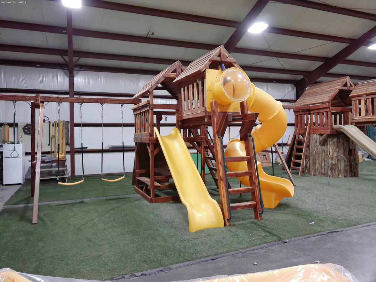 Cedar playsets with spiral slides in the Ozark shop